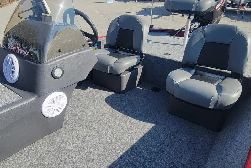 Slide: The Image of 2024 Tracker Bass Tracker Classic XL boat interior with seating and console. - 9
