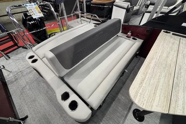 Slide: The Image of 2026 Harris Sunliner 230 boat interior with plush seating and cup holders. - 12