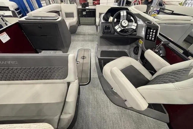 Slide: The Image of 2026 Harris Sunliner 230 boat interior with modern seating and steering console. - 19
