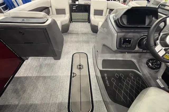 Slide: The Image of Interior of 2026 Harris Sunliner 230 boat, featuring modern seating and sleek dashboard design. - 25