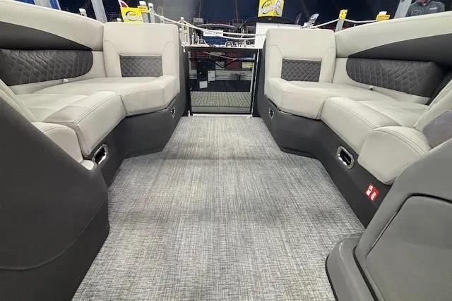 Slide: The Image of Interior of 2026 Harris Sunliner 230 boat with gray seating and carpet flooring. - 31