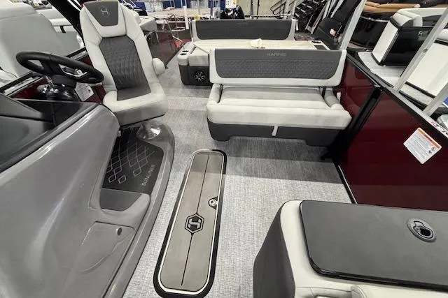 Slide: The Image of 2026 Harris Sunliner 230 boat interior with modern seating and sleek design. - 6