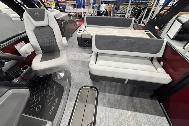 Slide: The Image of 2026 Harris Sunliner 230 interior with plush seating and modern design. - 8