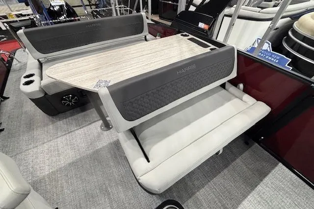 Slide: The Image of 2026 Harris Sunliner 230 interior with stylish seating and table setup. - 9