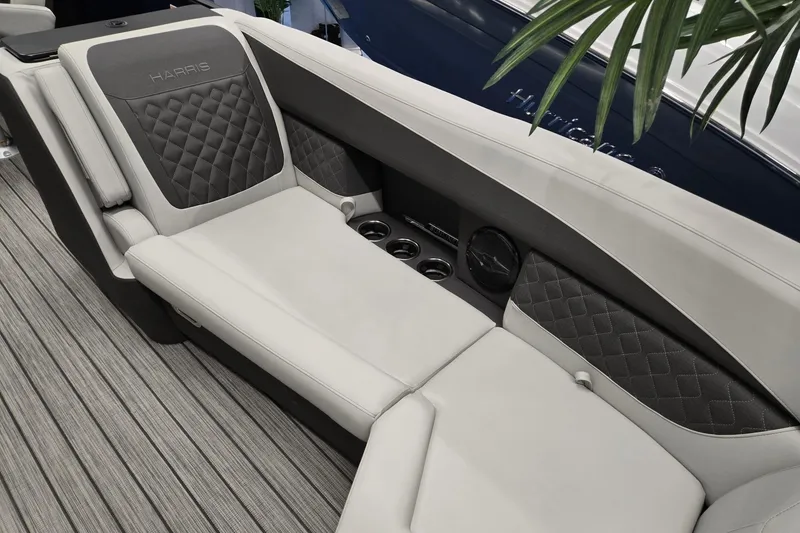 Slide: The Image of Luxurious seating on 2026 Harris Sunliner 230 boat with quilted upholstery and cup holders. - 11
