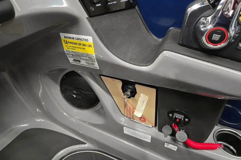 Slide: The Image of Control panel of 2026 Harris Sunliner 230 boat, showing capacity label and ignition key. - 19