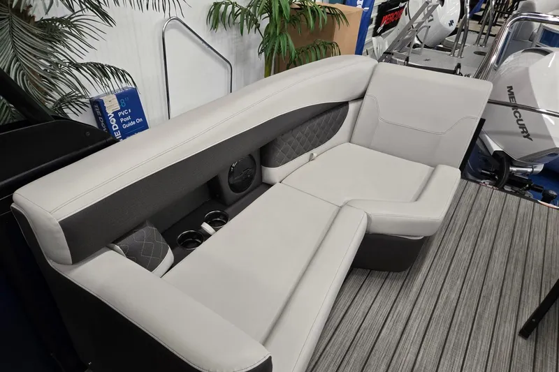 Slide: The Image of Luxurious seating on 2026 Harris Sunliner 230 boat with modern design and cup holders. - 23