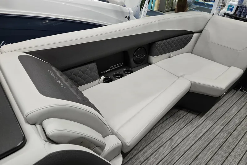 Slide: The Image of Luxurious seating on 2026 Harris Sunliner 230 boat with elegant upholstery and cup holders. - 34