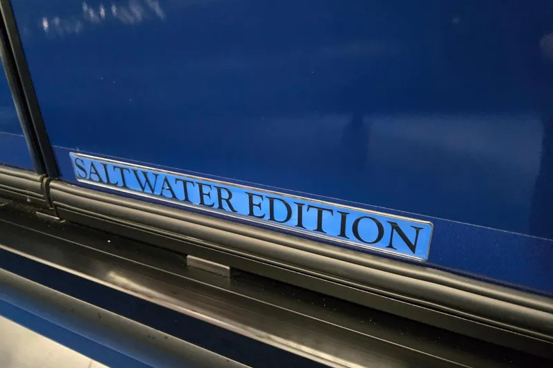 Slide: The Image of 2026 Harris Sunliner 230 Saltwater Edition, blue exterior detail. - 36