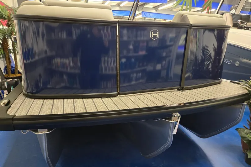 Slide: The Image of 2026 Harris Sunliner 230 pontoon boat with sleek blue exterior and modern design. - 8