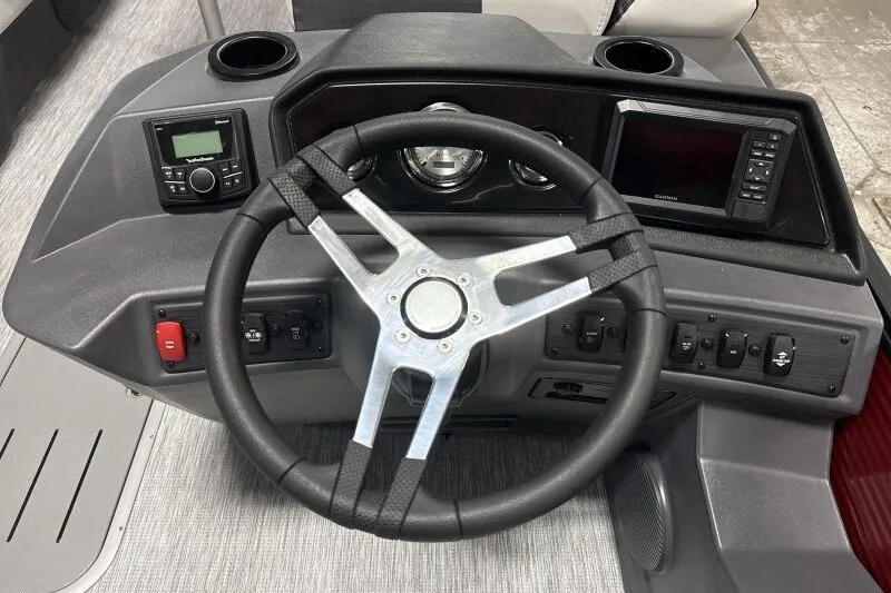 Slide: The Image of 2026 Bennington 22 SSBSF boat dashboard with steering wheel and control panel. - 12