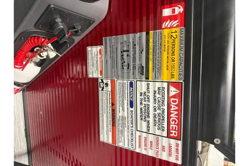 Slide: The Image of Safety and capacity labels on 2026 Bennington 22 SSBSF boat dashboard. - 24