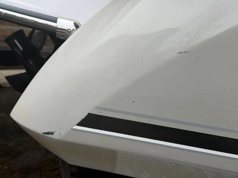 Slide: The Image of Close-up of a 2019 Monterey 224FS boat hull with scratches. - 11