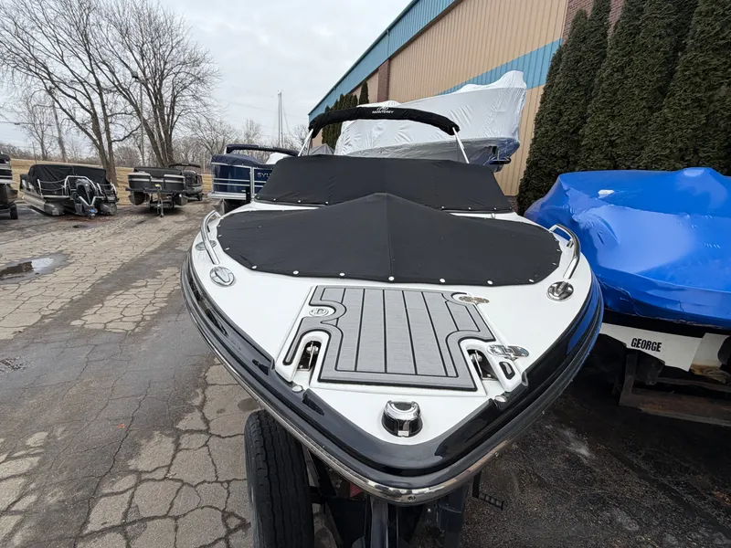 Slide: The Image of 2019 Monterey 224FS boat with cover in parking area. - 13