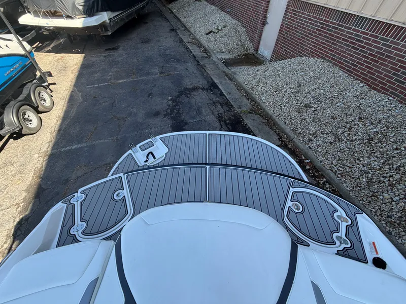 Slide: The Image of Rear view of a 2019 Monterey 224FS boat on a parking lot. - 16