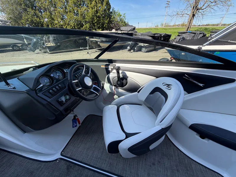 Slide: The Image of Interior of a 2019 Monterey 224FS boat with steering console. - 21