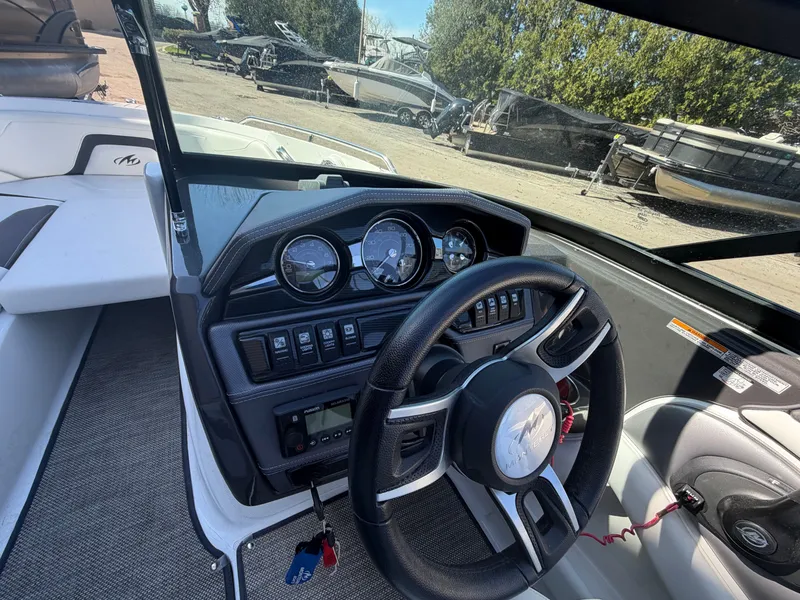Slide: The Image of Interior view of a 2019 Monterey 224FS boat with dashboard. - 22