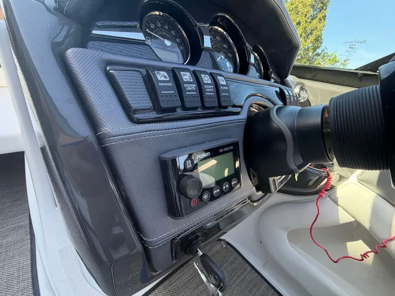 Slide: The Image of 2019 Monterey 224FS boat dashboard with controls and gauges. - 24