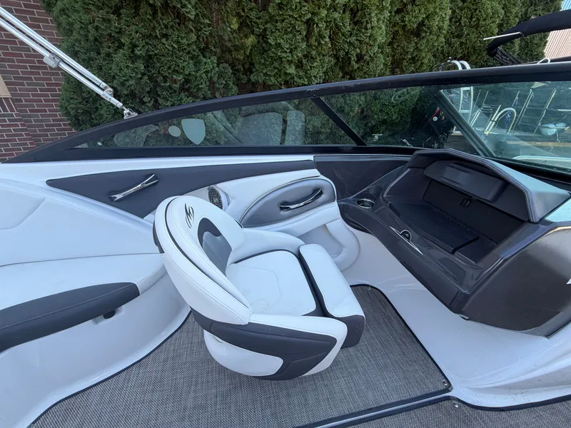 Slide: The Image of Interior of a 2019 Monterey 224FS boat with white seating. - 26
