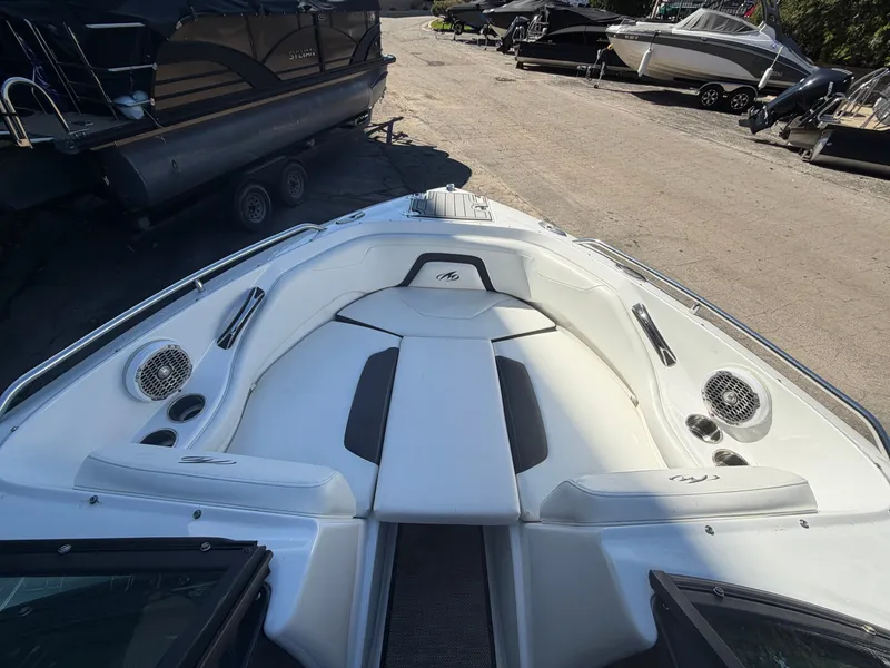 Slide: The Image of Interior view of a 2019 Monterey 224FS boat, white upholstery. - 30