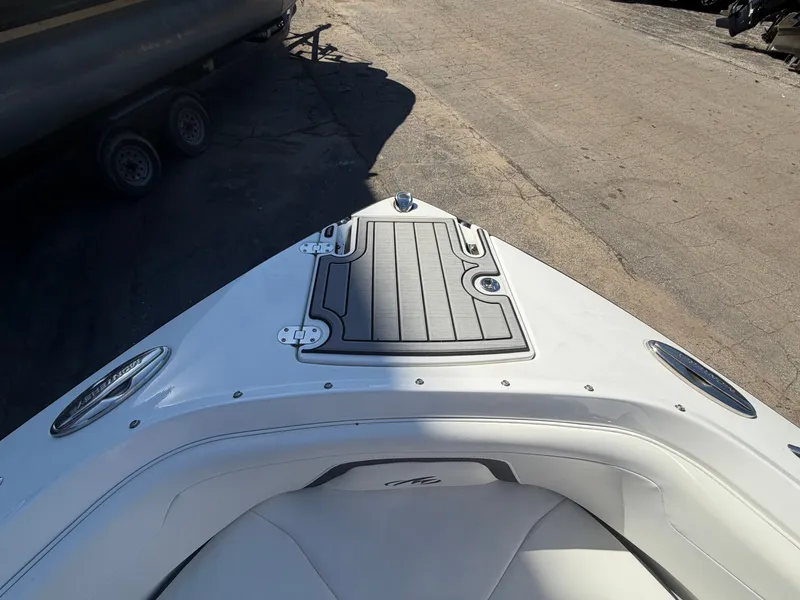 Slide: The Image of Bow deck of a 2019 Monterey 224FS boat on a parking lot. - 32