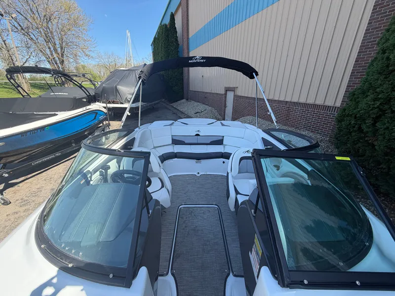 Slide: The Image of 2019 Monterey 224FS boat with open cockpit and Bimini top. - 36
