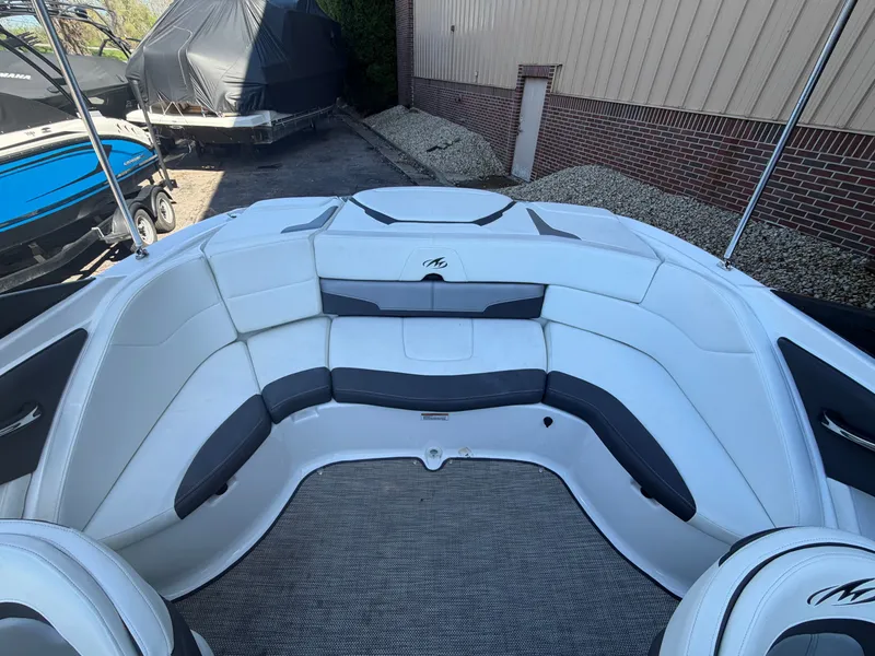 Slide: The Image of Interior of a 2019 Monterey 224FS boat with white and black upholstery. - 37