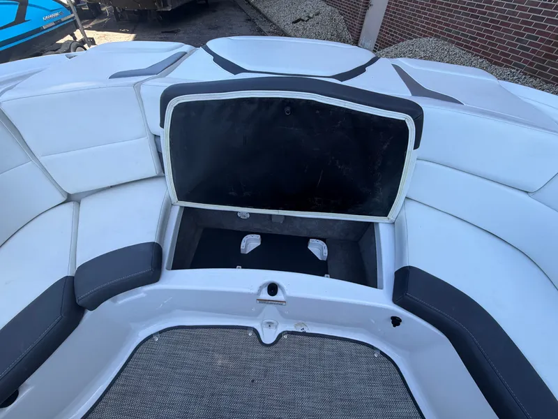 Slide: The Image of Interior of a 2019 Monterey 224FS boat with open storage compartment. - 38
