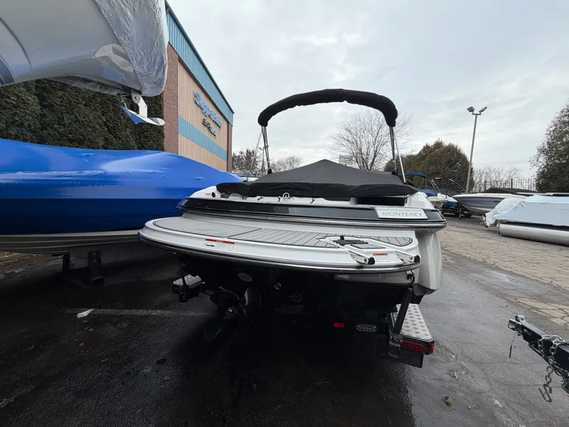 Slide: The Image of 2019 Monterey 224FS boat parked outdoors, rear view. - 4