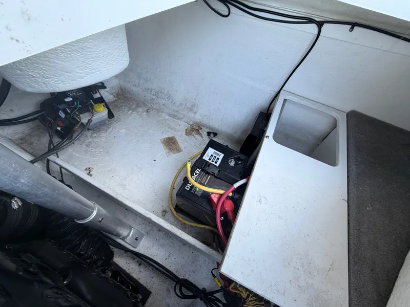 Slide: The Image of Interior of a 2019 Monterey 224FS boat with battery and wiring. - 41