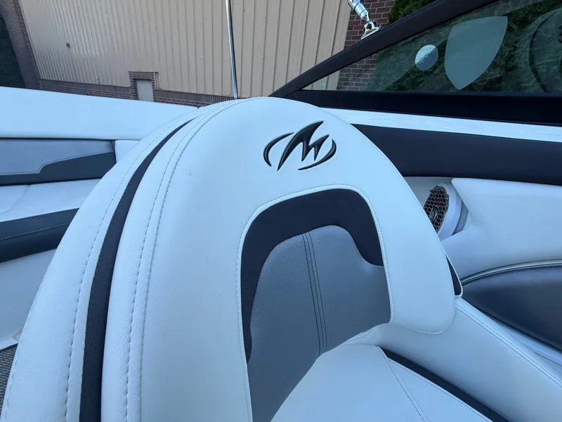 Slide: The Image of Interior of a 2019 Monterey 224FS boat with logo on seat. - 44