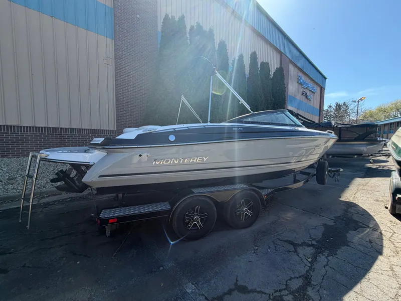 Slide: The Image of 2019 Monterey 224FS boat on trailer outside building. - 47