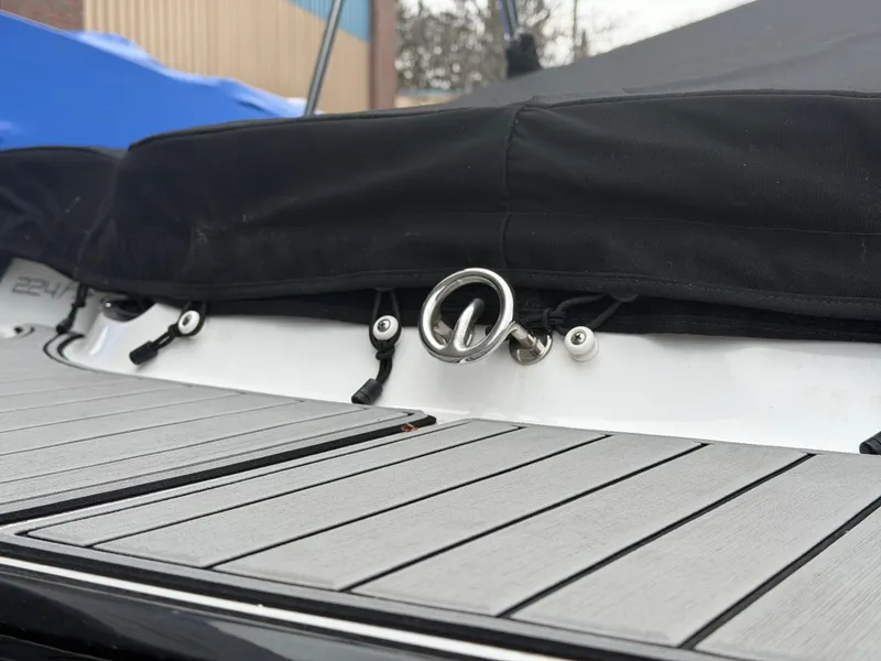 Slide: The Image of 2019 Monterey 224FS boat with cover and deck details. - 9