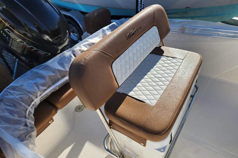 Slide: The Image of Brown and white cushioned seat on 2026 Pioneer 180 Islander boat. - 4
