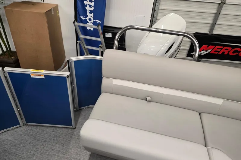 Slide: The Image of 2026 Godfrey EX 2086 CX pontoon boat interior with gray seating and blue panels. - 10