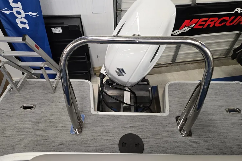 Slide: The Image of 2026 Godfrey EX 2086 CX boat with outboard motor and stainless steel railing. - 12