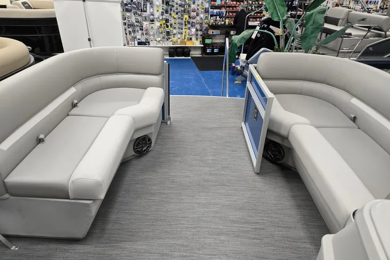 Slide: The Image of 2026 Godfrey EX 2086 CX pontoon boat interior with gray seating and modern design. - 15