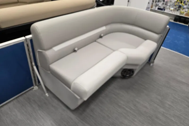 Slide: The Image of 2026 Godfrey EX 2086 CX boat seating, gray upholstery, modern design, showroom display. - 17