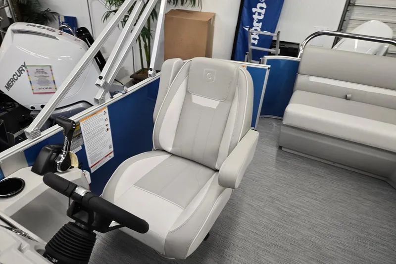 Slide: The Image of 2026 Godfrey EX 2086 CX boat interior with Mercury engine and luxurious seating. - 7