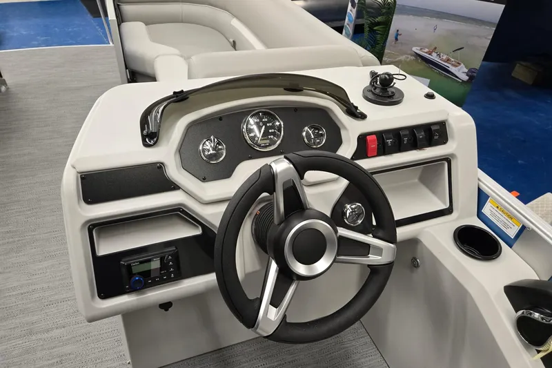 Slide: The Image of 2026 Godfrey EX 2086 CX boat dashboard with steering wheel and control panel. - 8