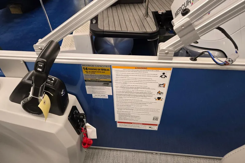 Slide: The Image of Control panel and capacity warning on 2026 Godfrey EX 2086 CX boat. - 9