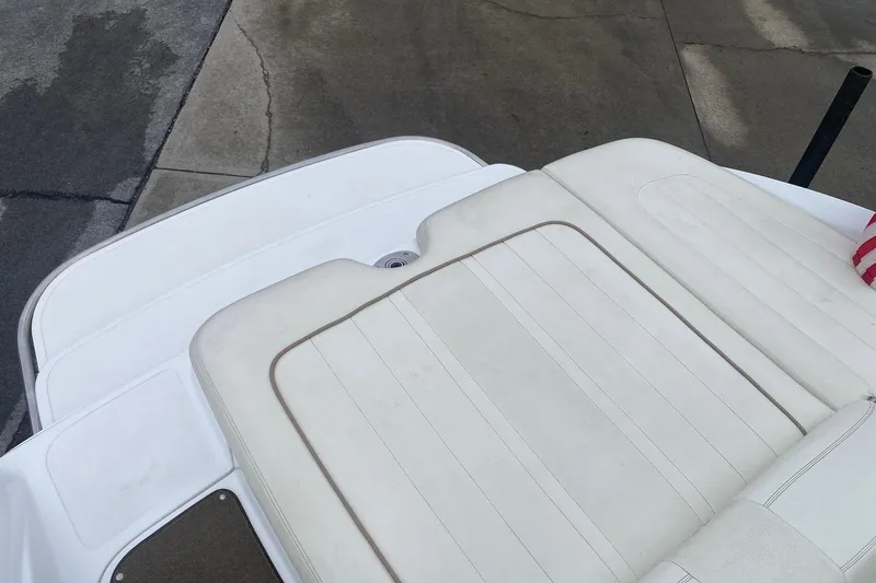 Slide: The Image of Rear seating area of a 2008 Cobalt 222 boat with white upholstery. - 13