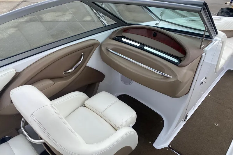 Slide: The Image of Interior of a 2008 Cobalt 222 boat with white and beige seating. - 9