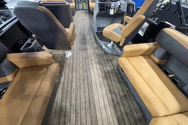 Slide: The Image of 2026 Harris Sunliner 230 interior with tan seating and modern dashboard design. - 13