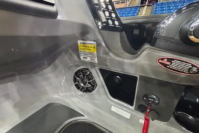 Slide: The Image of 2026 Harris Sunliner 230 boat dashboard with controls, fan, and safety features. - 16