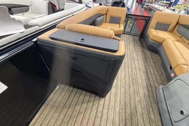 Slide: The Image of 2026 Harris Sunliner 230 interior with tan seating and wood-style flooring. - 20