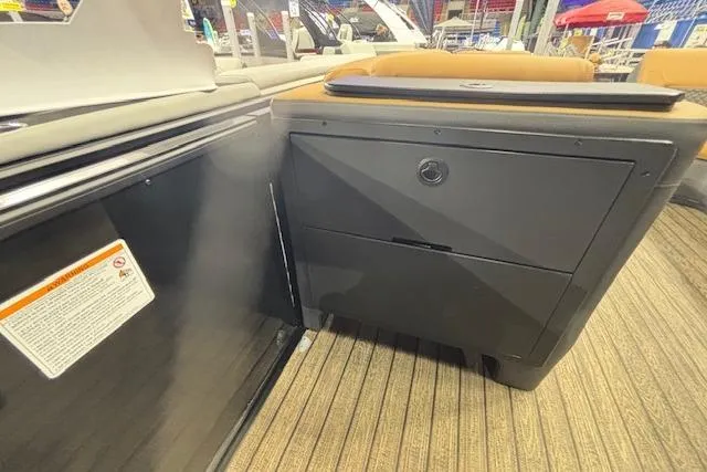 Slide: The Image of 2026 Harris Sunliner 230 interior with sleek storage compartment and modern design. - 22