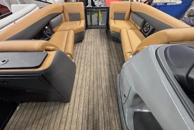 Slide: The Image of 2026 Harris Sunliner 230 interior with tan seating and modern design. - 25