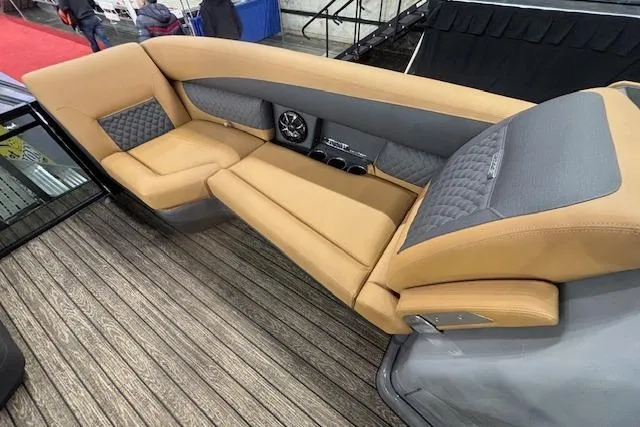 Slide: The Image of Luxurious seating on 2026 Harris Sunliner 230 boat with tan and gray upholstery. - 26