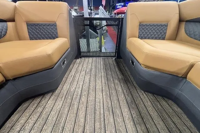 Slide: The Image of Interior of 2026 Harris Sunliner 230 pontoon boat with tan and gray seating. - 28